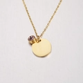 Detailed shot of golden mirror finish disk pendant with purple gemstone on delicate chain - 6# Birthstone