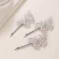 Tre forcine in metallo argento con farfalle traforate e finitura glitterata elegante - Argento Set di 3