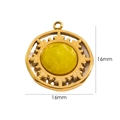 Detailed view of a 16mm gold sunburst pendant with a yellow gemstone inlay - Sun Ray/Topaz