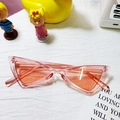 Pink cat-eye kids sunglasses with orange lenses in a retro triangle frame design - Transparent Pink