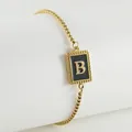 Titanium steel bracelet in 18K gold finish with black enamel letter B pendant detail - Letter B (ZH497G-B-02)