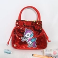 Detail of red sequin handbag featuring a unicorn patch and soft handles for girls - Red Unicorn