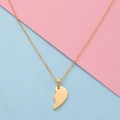 Detailed view of the gold split heart pendant with a fine cable chain on a pink background - Small Gold Single Piece