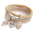 Detailed view of skull charms with rhinestones on three-tone popcorn chain bracelets - 1042 Skull Set