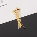 Close-up of golden stainless steel ball head pins for DIY jewelry making and beading - 0.6*30mm / Ball Head Pin Golden
