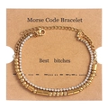 Detail of gold double-layer Morse code bracelet with rhinestones on a kraft display card - Best Bitches Gold