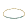 Handmade layered natural stone beaded bracelet with gold accents and light blue gemstones - Amazonite
