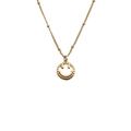 Detailed view of the gold-plated smiley face pendant necklace with cubic zirconia - Golden Hollow Smiley