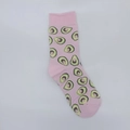 Detail of pink cotton crew socks featuring an all-over green avocado jacquard pattern - One Size / Pink Avocado