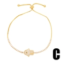 Adjustable golden Hamsa hand bracelet with white zircon and black evil eye detail - Style C (Gold Hamsa Hand)