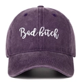 Detailed close-up of cursive white embroidery on a washed purple cotton baseball cap - Purple