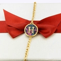 18k gold plated round abalone shell bracelet with 'H' charm on a gift box - Letter H