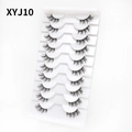 Detailed macro view of 10 pairs natural cat-eye false eyelashes on white tray - Curled Voluminous Style (XYJ10) / 10 Pairs Set