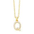 Close-up of gold initial Q necklace pendant featuring elegant inlaid white pearls - Gold Letter Q
