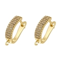 Macro detail of 18K gold plated U-shaped earring hoops with pavé set white zircon stones - Gold