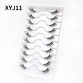 Close-up of 10 pairs of natural criss-cross cat eye false eyelashes in a white tray - Curled Voluminous Style (XYJ11) / 10 Pairs Set