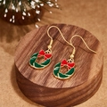 Festive gold Christmas wreath earrings with a red bow on a rustic wooden base - Green Wreath with Red Bow Style (E00910G)