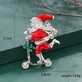 Detail view of Santa Claus on scooter brooch showing dimensions 5.1cm by 3.6cm - Scooter Santa