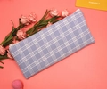 Detailed view of the purple plaid canvas pencil case with a white zipper on pink background - Sea Salt Gray Plaid
