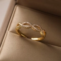 Elegant gold plated open ring with pavé cubic zirconia on a brown jewelry box - Adjustable Open / 13706/Infinity Symbol