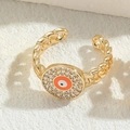 Golden chain style evil eye ring with orange enamel and micro-pave cubic zirconia - Orange