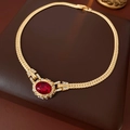 Detail of vintage gold snake chain necklace with a red oval gem and rhinestone pavé - Gold-Red