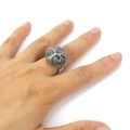 Detail of handcrafted wire-wrapped Tree of Life ring with labradorite stone on finger - Flash Stone (Labradorite)