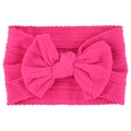 Soft rose red nylon baby headband featuring a large bow and ribbed knit texture - Rose Red