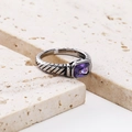 Detailed macro view of vintage cable ring with rectangular purple stone and 18k gold accents - Steel Color Purple Zirconia