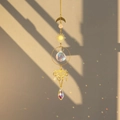 Detailed view of brass butterfly suncatcher casting colorful rainbow light on wall - Flower Butterfly
