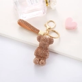 Detail of champagne gold rhinestone bear keychain with woven strap and metal clasp - Champagne