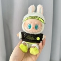 Labubu plush toy in E-SPORT outfit with white rabbit hood and green fleece shoes - Tennis Boy Style / First And Second Generation Keychains Are Compatible With La Cloth Dolls. Dolls Not Included.