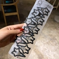 Set of 10 matte black star shaped metal hair clips on a white display card for styling - Star Shape 10-Piece Set
