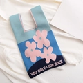 Blue knitted tote bag with pink flower patterns and YOU ONLY LIVE ONCE text detail - Blue-Flower