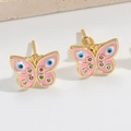 Detailed close-up of pink butterfly earrings with evil eye pattern and crystal accents - Pink Butterfly