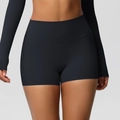 Dettaglio dei pantaloncini yoga neri a vita alta con controllo della pancia e senza cuciture - S / Bottoms / Nero