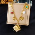 Golden stainless steel sun and heart pendant necklace displayed on a beige jewelry box - Sun Face Multi-Pendant Style (N3507)