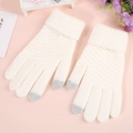 Detail of touchscreen knitted gloves showing conductive grey tips and ribbed cuffs - Pineapple Texture White