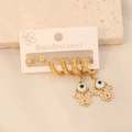 Detail of gold stainless steel earring set featuring Hamsa Hand and Evil Eye charms - 6Pcs Hand of Fatima Evil Eye Set (5#)