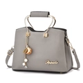 Grey pebbled leather handbag with arched gold metal handles and tassel detail - Gray