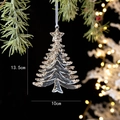 Detail of acrylic Christmas tree ornament with golden sequins on a pine branch - Flat Christmas Tree