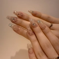 Elegant nude pink press-on nails with black polka dots, silver glitter, and rhinestones - By1565's Gentle Smile / Glue Type