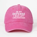 Close-up of pink washed cotton baseball cap with white printed text slogan and eyelets - Rose Red