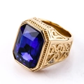 Elegant gold-tone ring with a large rectangular blue gemstone and detailed vintage engravings - US 7 / Gold Blue