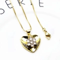 Detailed view of a gold heart pendant with cubic zirconia inlay on a golden box chain - Classic Heart-Gold (with Necklace)