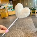 Close-up of cute white plush heart ball on top of a creative rainbow ballpoint pen - Off White