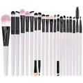 Flat lay of 20-piece makeup brush set with white handles and pink-white gradient bristles - White Handle + Black Tube