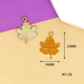 Detail showing orange enamel maple leaf pendant size 16x23mm with golden back texture - Yellow Maple Leaf