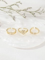 Three-piece gold-plated ring set featuring pave zircon heart and leaf designs on marble - Heart Flower Leaf Combo Style (Gold)