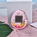 Pink egg-shaped virtual electronic pet game console with metal keychain and yellow buttons - Chicken/Pink